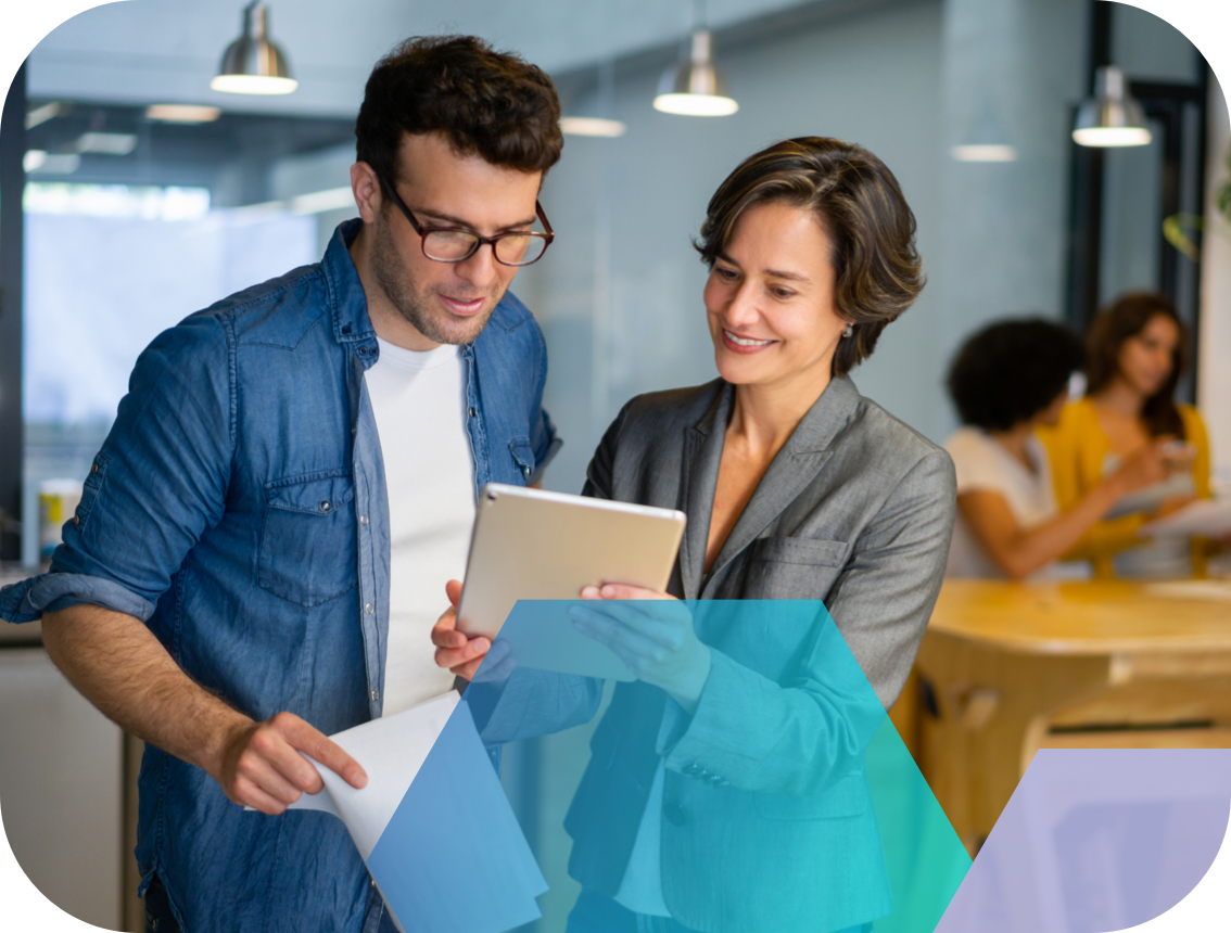 Man and woman looking at information on tablet